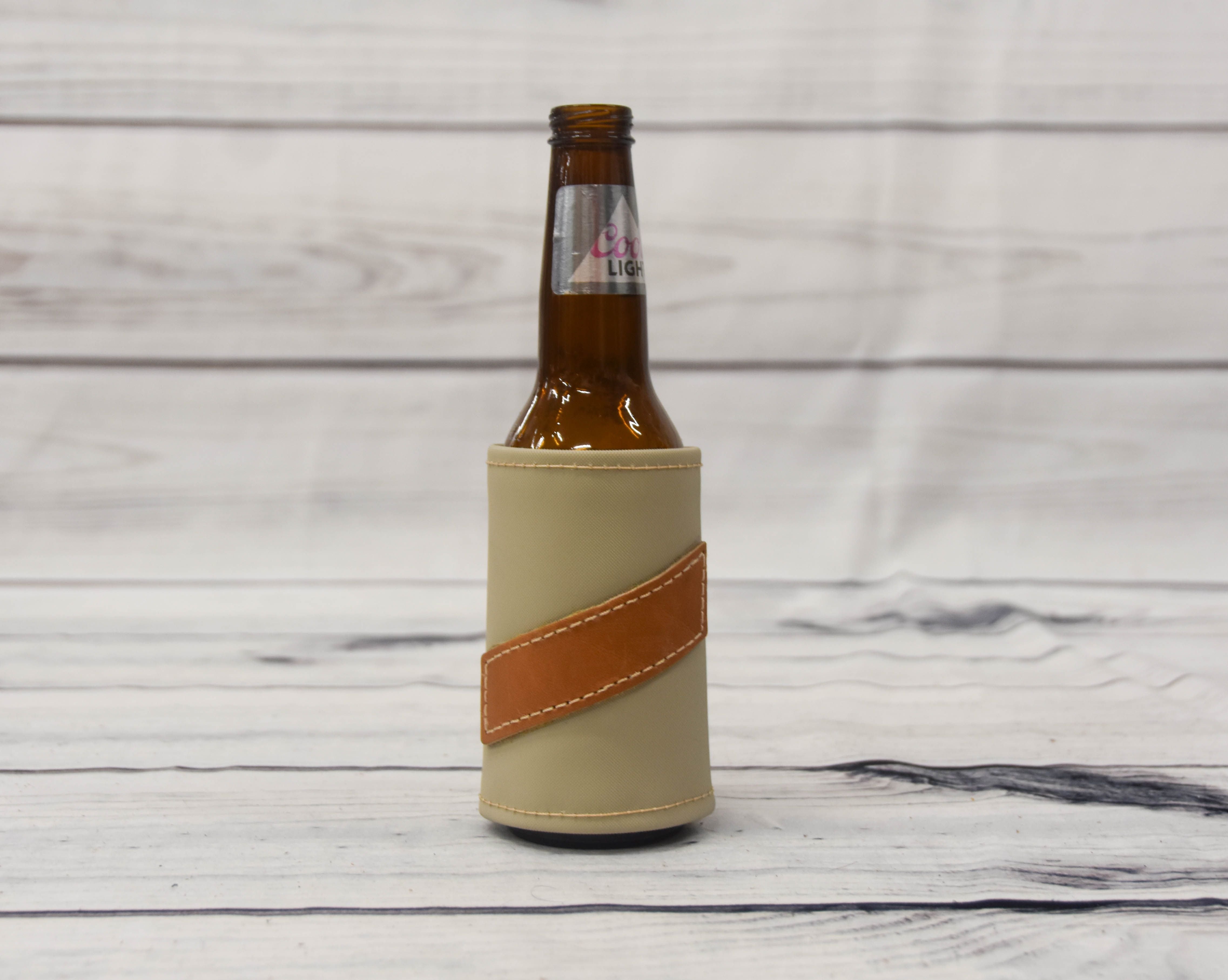 https://twodoveoutdoors.com/cdn/shop/products/bottlekoozie_4547x.jpg?v=1620160942